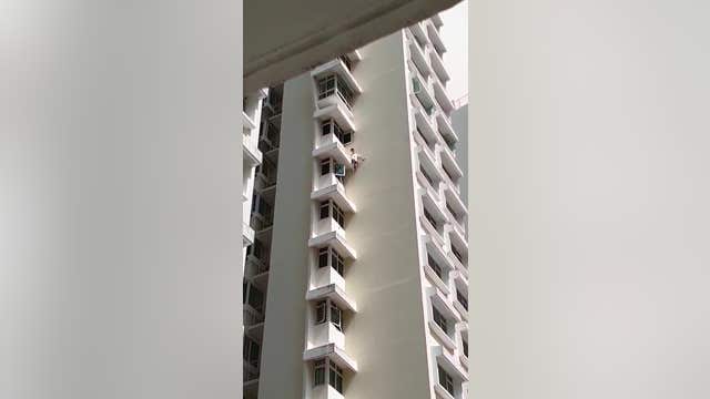 Teen falls from 17th-floor ledge onto air cushion in Singapore