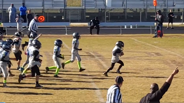 Youth football team helps special needs student score touchdown