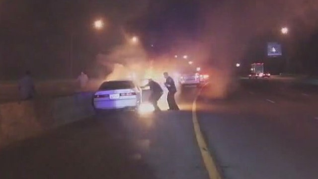 Officers honored for pulling driver from burning car