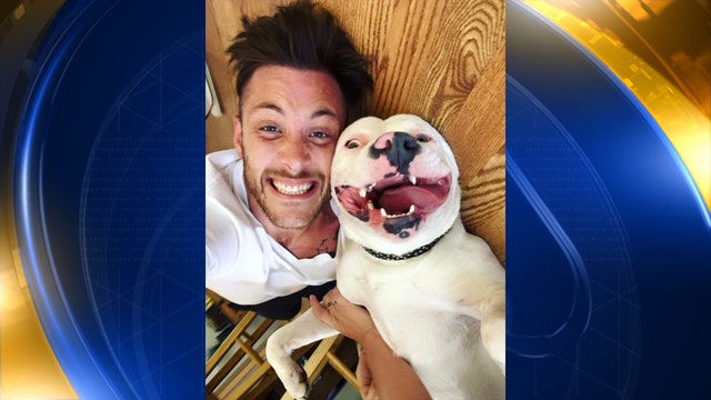 Dog's adoption in jeopardy after smiling photo goes viral