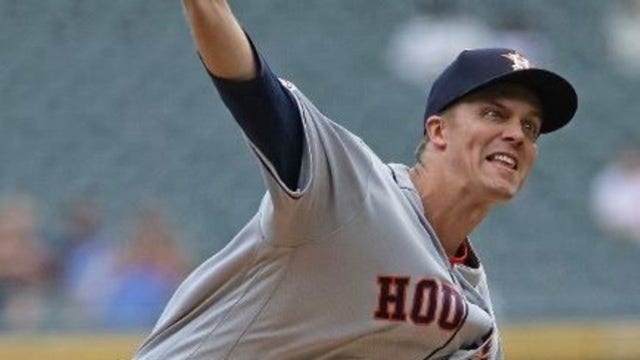 Greinke gets 200th win, pitches Astros past A's 4-1