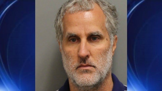 Kennesaw police arrest man with 13 dogs for animal cruelty