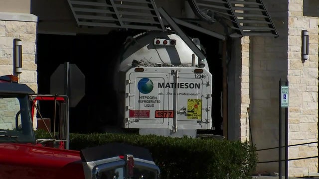 Driver dies after heavy truck crashes into restaurant