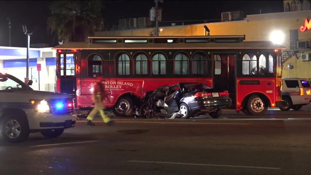 Firefighters cut driver out of car after crash with Galveston trolley
