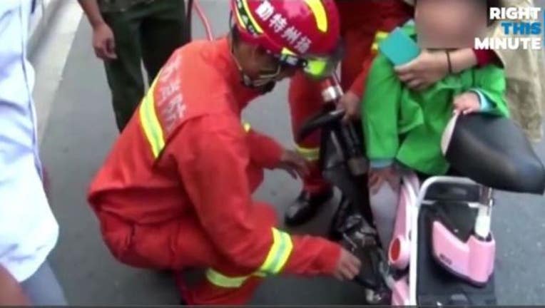 Poor Toddler Gets Foot Stuck in Mom's Moped Wheel-407068