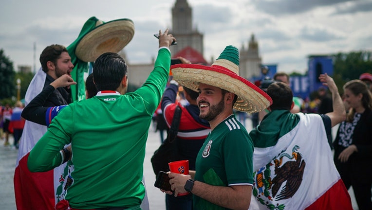 69469f76-GETTY Fans of Mexico in Moscow for the World Cup soccer games-404023