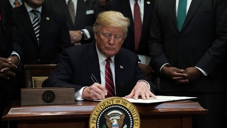 248c7077-GETTY President Trump at Desk-401096