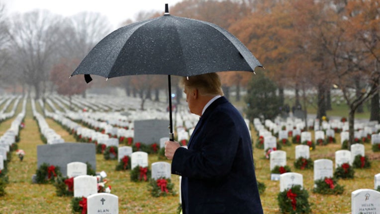 e396d0f7-GettyImages-USA TRUMP ARLINGTON CEMETERY_1544991225399