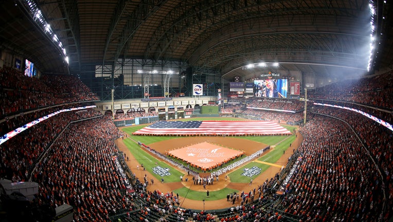 HOUSTON: An American flag is displayed during the national anthem prior to Game 1 of the 2019 World Series between the Houston Astros and the Washington Nationals at Minute Maid Park.