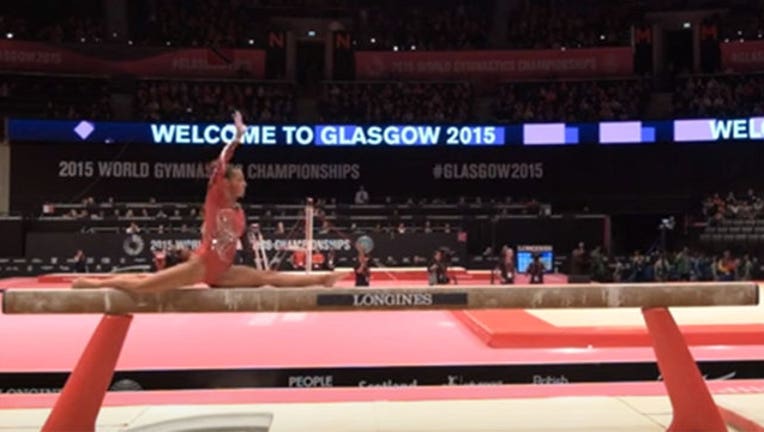 efef6e2d-Gymnast Creates New Move-402970