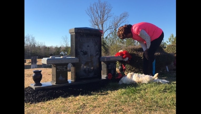 92a10917-$10K gravestone damaged-403440