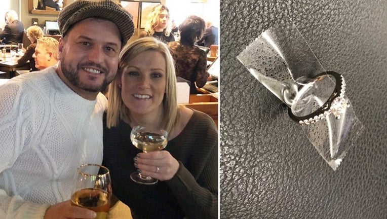 53900954-NYPD_engagement_ring_couple_120218_1543781801619-401096.jpg