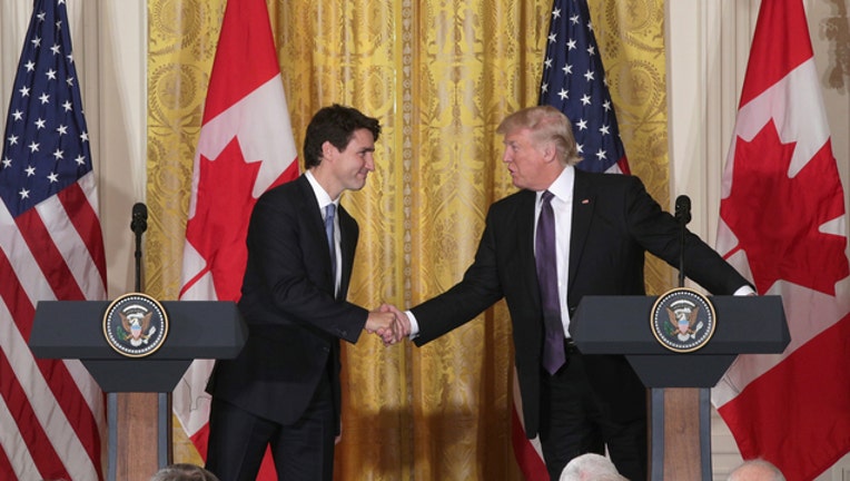 ef22cc9f-TRUMP-TRUDEAU-GETTY_1535842243279-401720.jpg