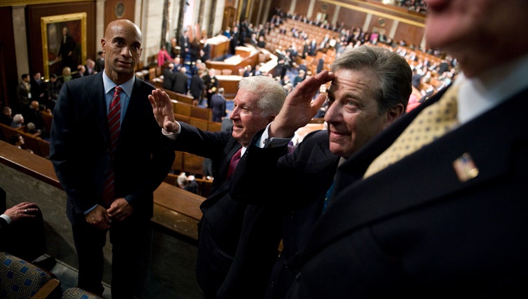 From left, Adrian Fenty, mayor of D.C., Thomas D'Alesandro, brother of Speaker Nancy Pelosi, and Paul Pelosi, husband of the Speaker, greet guests before President Barack Obama addressed a joint session of Congress in the House Chamber, February 24, 2009. (Photo By Tom Williams/Roll Call/Getty Images)