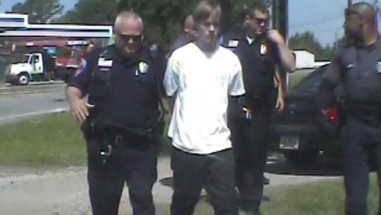 40b9d6a2-roof dylann arrest_1439821051782-403440.jpg