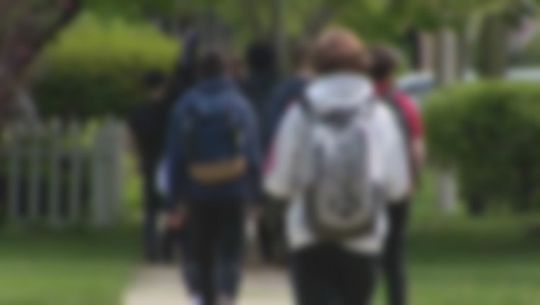 fb80226e-students walking blur_1558481941083.jpg-404023.jpg