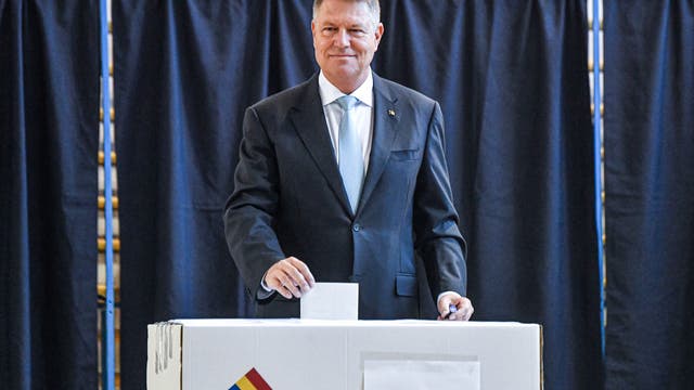 Romanian presidential election voters casting ballots for 1 of 14 candidates