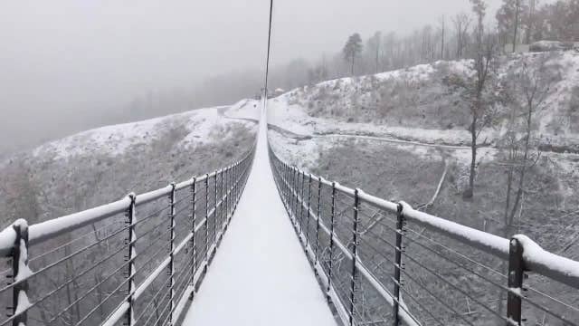 Stunning snowfall on suspension bridge in Tennessee's Great Smoky Mountains