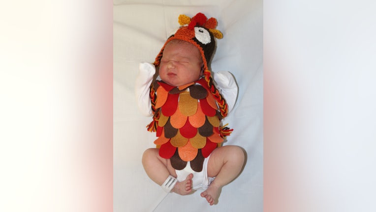 Kenzie is dressed as a turkey.