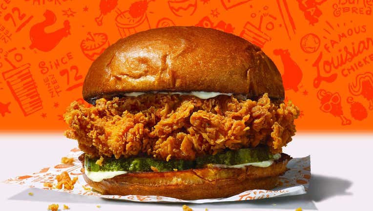 0e6e7a0c-The sold-out sandwich, which features a buttermilk-battered and hand-breaded chicken filet on a toasted brioche bun, topped with pickles and either mayo or spicy Cajun spread, is making its return. (Photo credit: Popeyes)