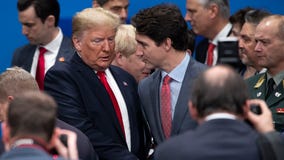 Trump hits back after Trudeau appears to mock him in NATO summit video