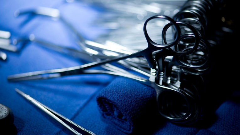 FILE PHOTO: Clamps, scissors and other surgical instruments are seen in the operating room during a kidney transplant.