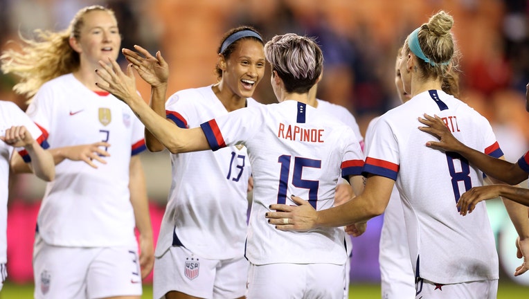 Lynn Williams #13 and Megan Rapinoe #15 of USA celebrate the second goal of their team during the group A game between United States and Haiti as part of the CONCACAF Women's Olympic Qualifying at BBVA Compass Stadium on January 28, 2020 in Houston, Texas.