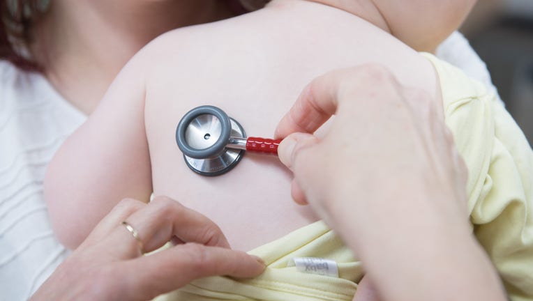 Child receiving care from a doctor.