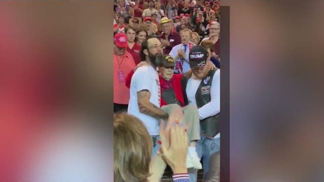 WWII veteran carried to his seat by fellow Trump supporters at Phoenix campaign rally
