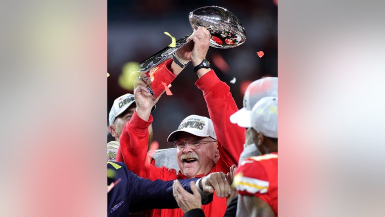 MIAMI, FLORIDA - FEBRUARY 02: Head coach Andy Reid of the Kansas City Chiefs celebrates with the Vince Lombardi Trophy after defeating the San Francisco 49ers 31-20 in Super Bowl LIV at Hard Rock Stadium on February 02, 2020 in Miami, Florida. (Photo by Maddie Meyer/Getty Images)