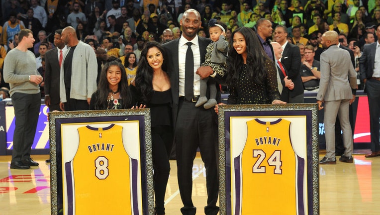 LOS ANGELES, CA - DECEMBER 18: Kobe Bryant, wife Vanessa Bryant and daughters Gianna Maria Onore Bryant, Natalia Diamante Bryant and Bianka Bella Bryant attend Kobe Bryant's jersey retirement ceremony during halftime of a basketball game between the Los Angeles Lakers and the Golden State Warriors at Staples Center on December 18, 2017 in Los Angeles, California. (Photo by Allen Berezovsky/Getty Images)