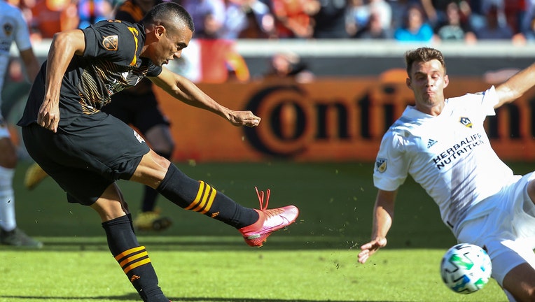 Feb 29, 2020; Houston, Texas: Houston Dynamo forward Mauro Manotas (9) scores a goal during the second half against the Los Angeles Galaxy at BBVA Stadium. 