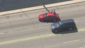 WATCH: Suspect stops to hand off baby in the middle of a Detroit Police chase