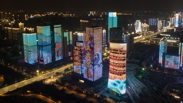 Masked crowds fill streets, trains after Wuhan lockdown ends