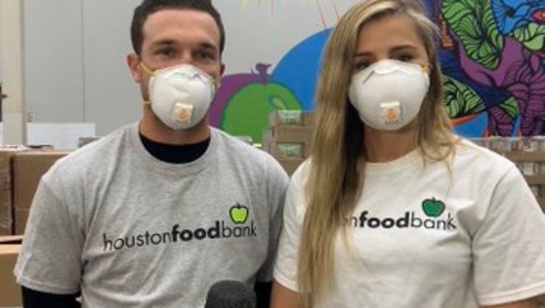 Alex Bregman and fiancée Reagan Howard help out at Houston Food Bank