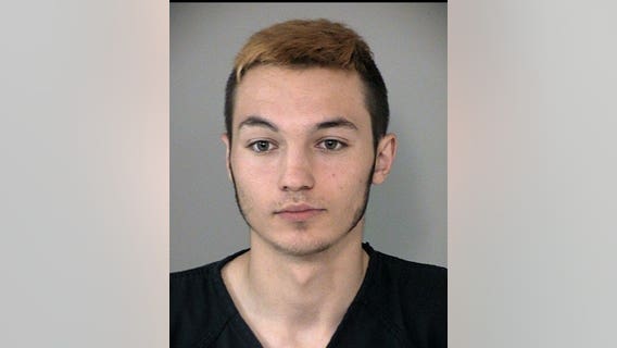 Deputies: 18-year-old spray painted racial slurs, graphic drawings on vehicles