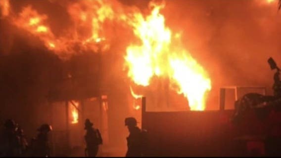 Woman taken into custody after Galveston house fire