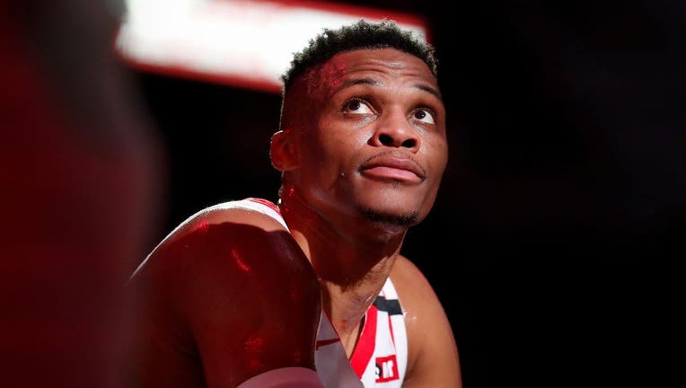 HOUSTON, TEXAS - MARCH 08: Russell Westbrook #0 of the Houston Rockets reacts on the bench in the first half against the Orlando Magic at Toyota Center on March 08, 2020 in Houston, Texas.