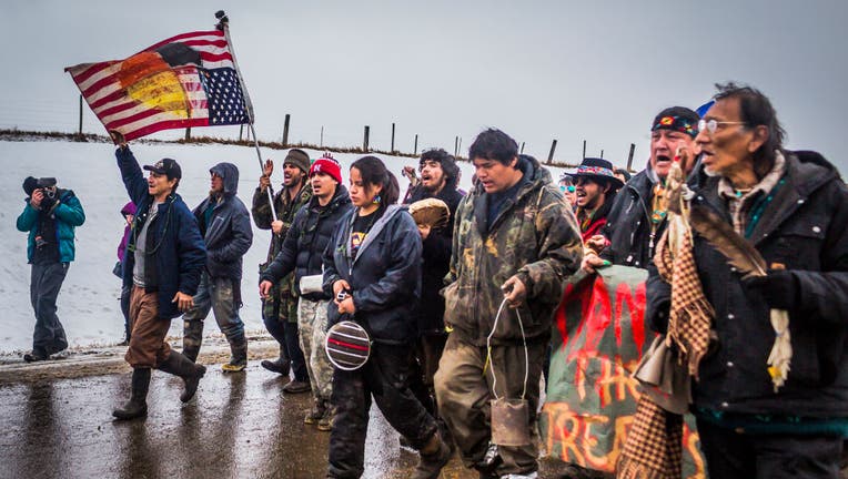 Defiant Dakota Access Pipeline water protectors faced-off