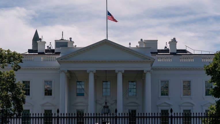 FILE - The US flag flies at half-mast above the White House in Washington, DC, on September 19, 2020 after the passing of US Supreme Court Justice Ruth Bader Ginsburg. - Ginsburg died September 18, 2020.