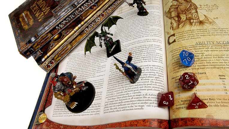 Books, die, figurines from Dungeons and Dragons to go with story on the game's creator, Gary Gygax