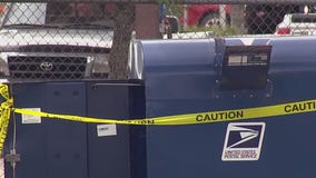 Inspectors at the Post Office investigate after a collection box was damaged
