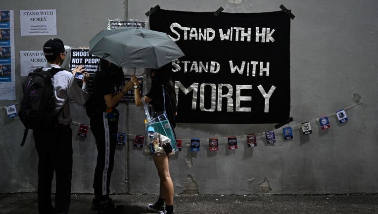 Protesters display posters at the Southorn Playground in Hong Kong on October 15, 2019, during a rally in support of NBA basketball Rockets general manager Daryl Morey and against comments made by Lakers superstar LeBron James. James sharply criticized Morey for angering China with a tweet supporting protesters in Hong Kong, saying the executive was 