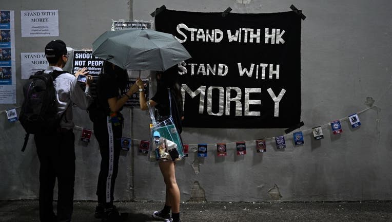 Protesters display posters at the Southorn Playground in Hong Kong on October 15, 2019, during a rally in support of NBA basketball Rockets general manager Daryl Morey and against comments made by Lakers superstar LeBron James. James sharply criticized Morey for angering China with a tweet supporting protesters in Hong Kong, saying the executive was