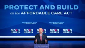 Biden fights to confront crises, Trump resistance