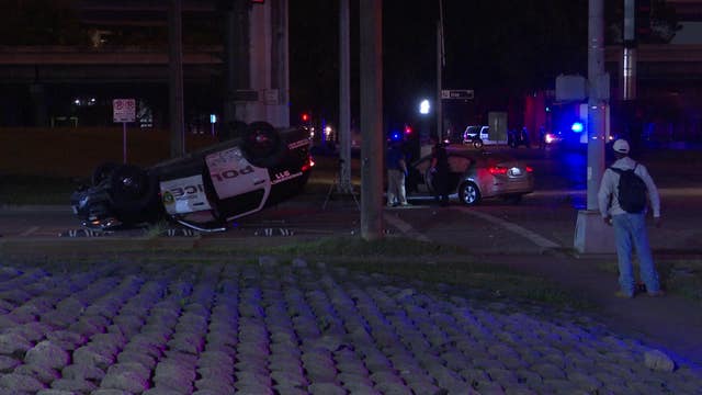 HPD: Officer's patrol vehicle flipped in crash with car that ran red light