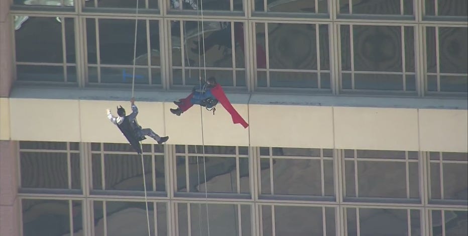 Superheroes surprise young patients at Houston's MD Anderson Cancer Center