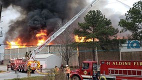 HFD battles large fire at warehouse on SH 249