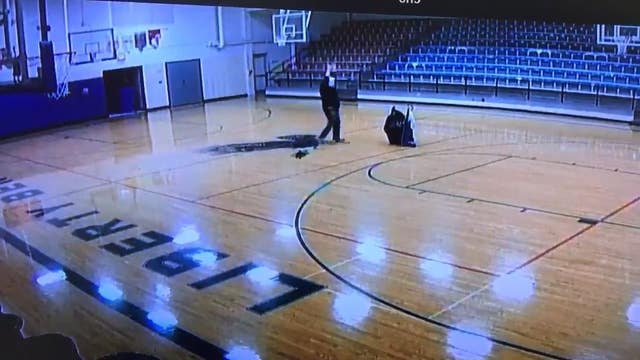 'Nothing but net': School custodian sinks half-court shot with back turned
