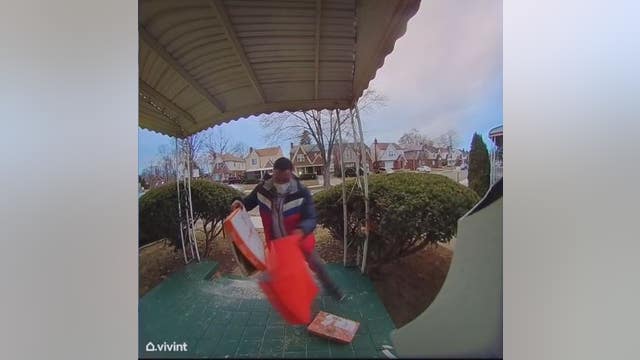DoorDash driver caught on camera dropping pizza on ground, stuffing it back in box